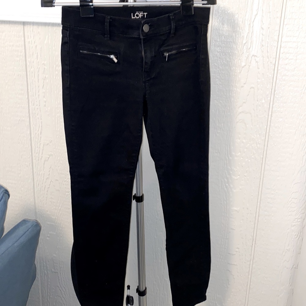 Super skinny black jeans with front zipper pockets